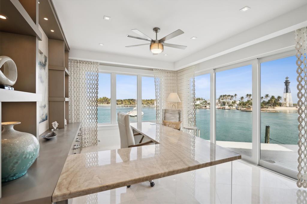 2400 Bay Drive Pompano Beach, FL 33062 - Photo 35 of 55 a kitchen with stainless steel appliances granite countertop a refrigerator a stove and a sink with large countertops