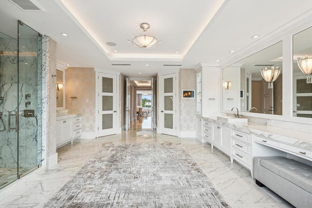 2400 Bay Drive Pompano Beach, FL 33062 - Photo 39 of 55 a large bathroom with a large mirror vanity and shower