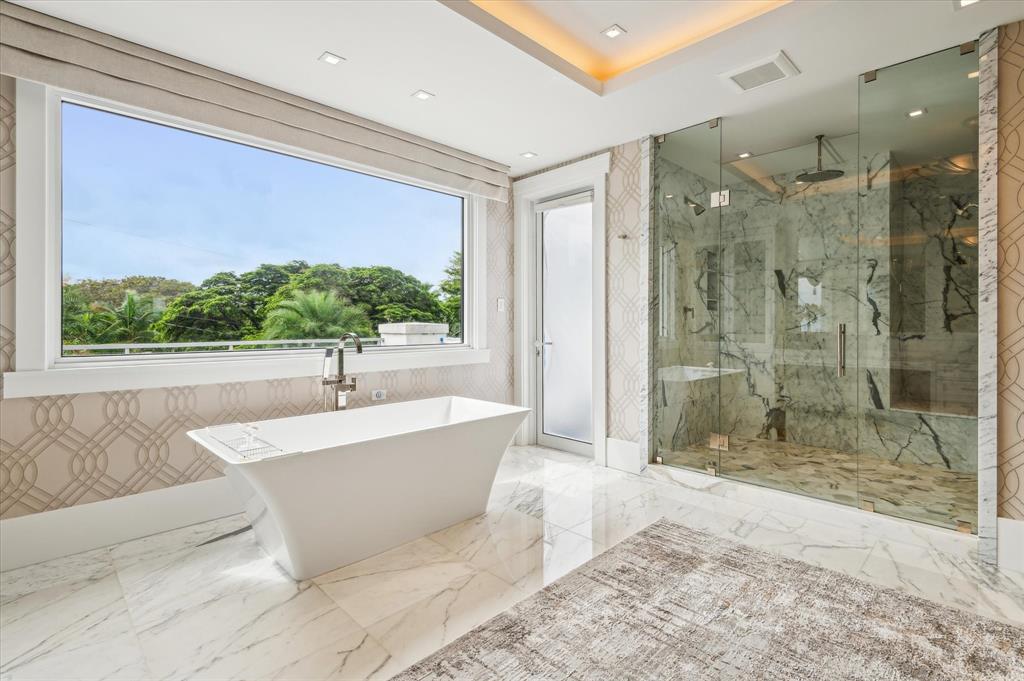 2400 Bay Drive Pompano Beach, FL 33062 - Photo 40 of 55 a bathroom with a bathtub and a shower