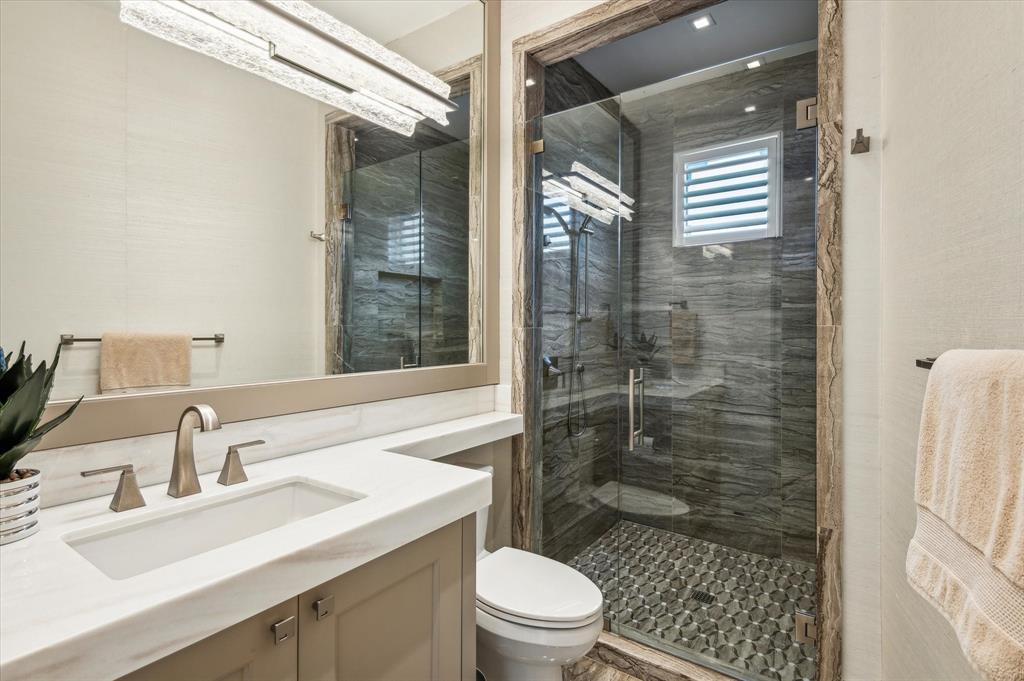 2400 Bay Drive Pompano Beach, FL 33062 - Photo 45 of 55 a bathroom with a sink a toilet and shower