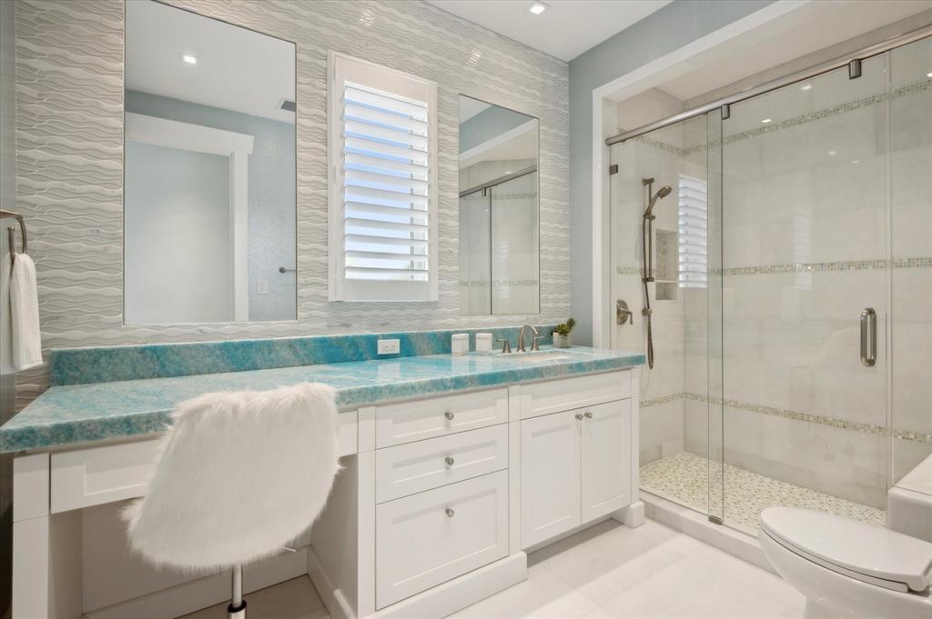 2400 Bay Drive Pompano Beach, FL 33062 - Photo 48 of 55 a bathroom with a granite countertop sink a toilet and shower