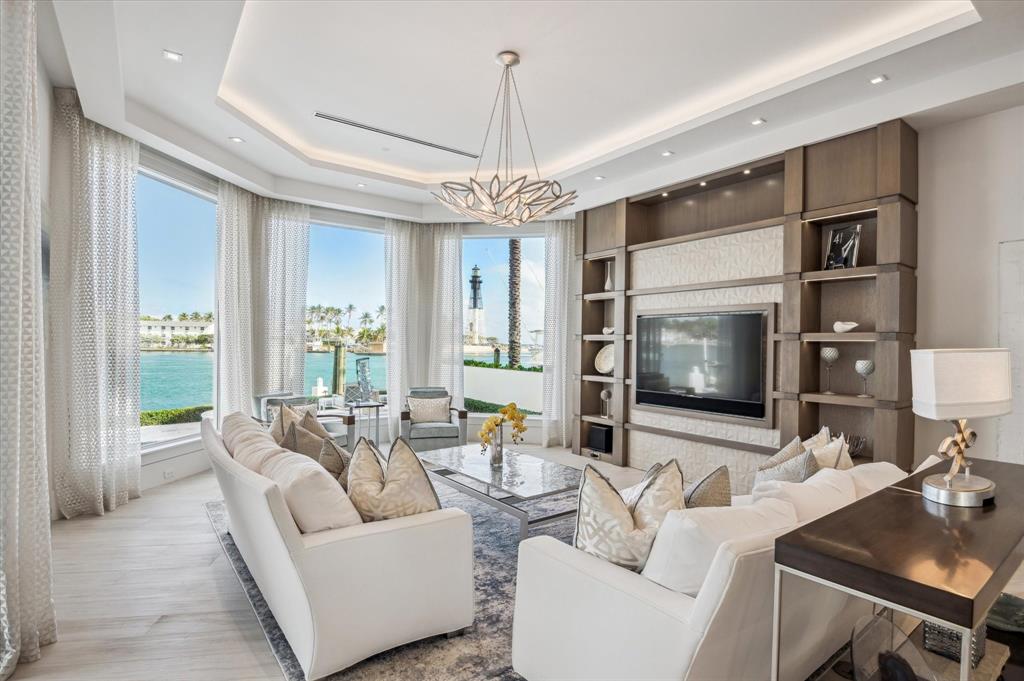 2400 Bay Drive Pompano Beach, FL 33062 - Photo 8 of 55 a living room with fireplace furniture and a flat screen tv