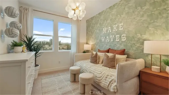 a bedroom with a bed and a potted plant on the dresser
