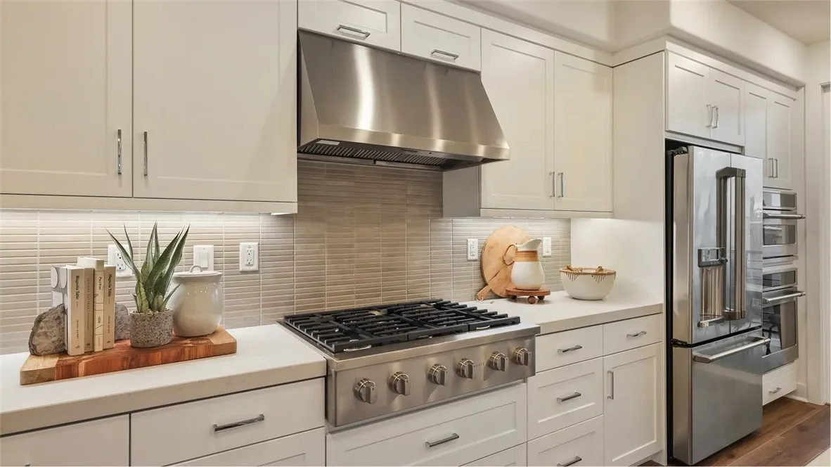 1803 Lychee Street Fullerton, CA 92835 - Photo 3 of 23 a kitchen with granite countertop a stove and a refrigerator