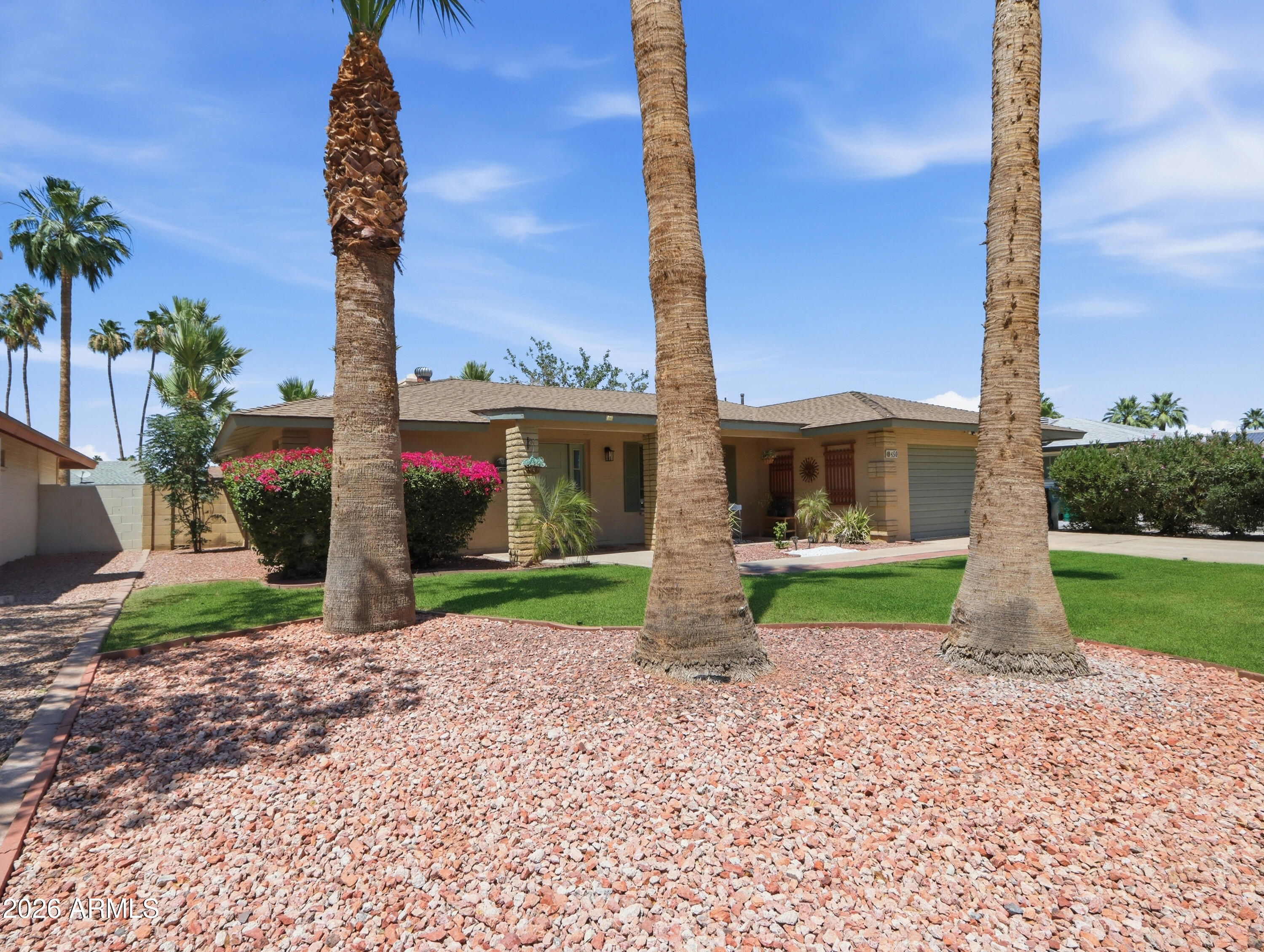 450 Cascada Road Litchfield Park, AZ 85340 - Photo 2 of 40 a view of a yard with a house and a park