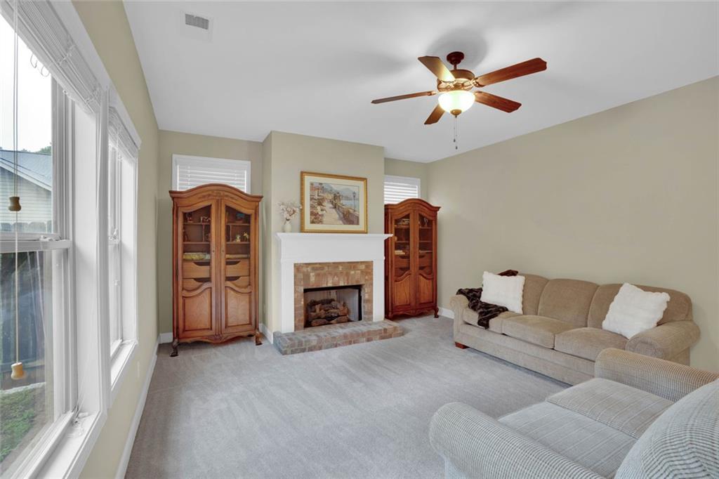 960 Verlander Trail Mableton, GA 30126 - Photo 11 of 30 a living room with furniture and a fireplace
