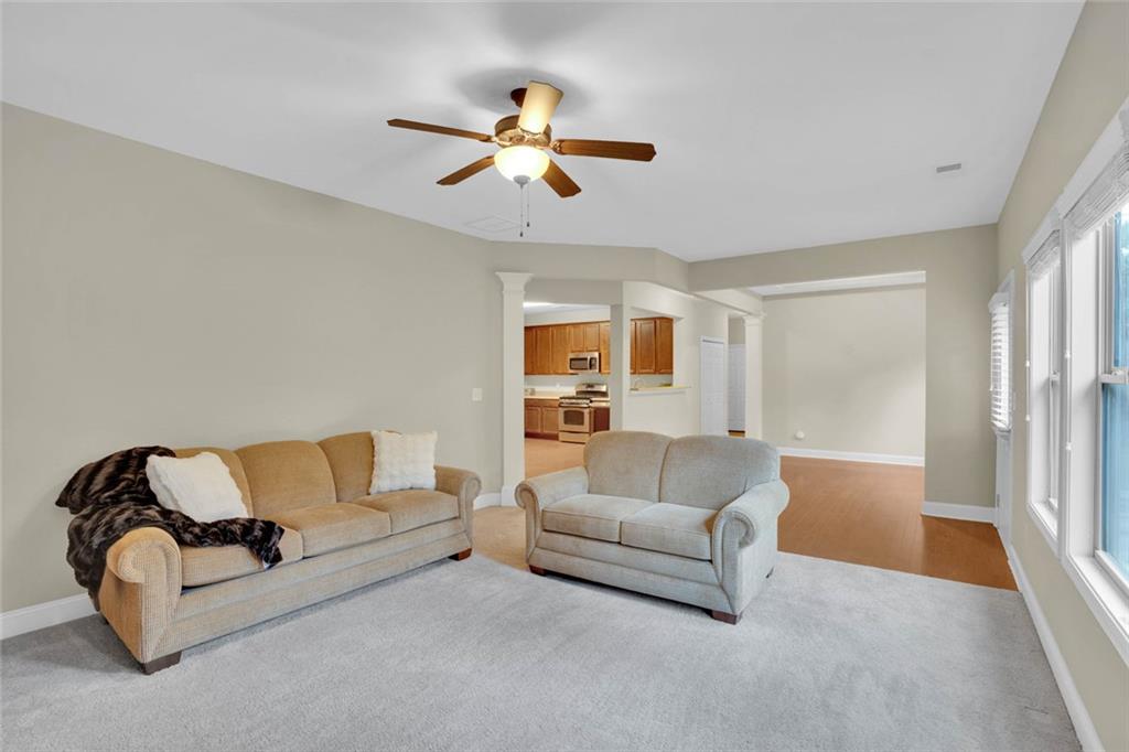 960 Verlander Trail Mableton, GA 30126 - Photo 12 of 30 a living room with furniture and a chandelier