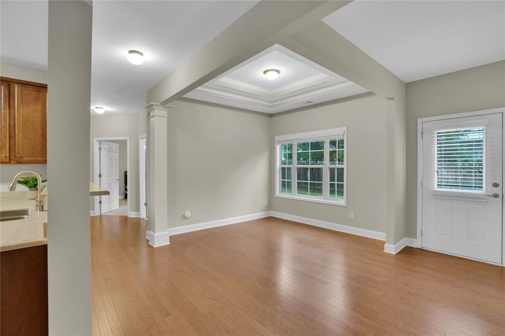 960 Verlander Trail Mableton, GA 30126 - Photo 17 of 30 an empty room with wooden floor and windows