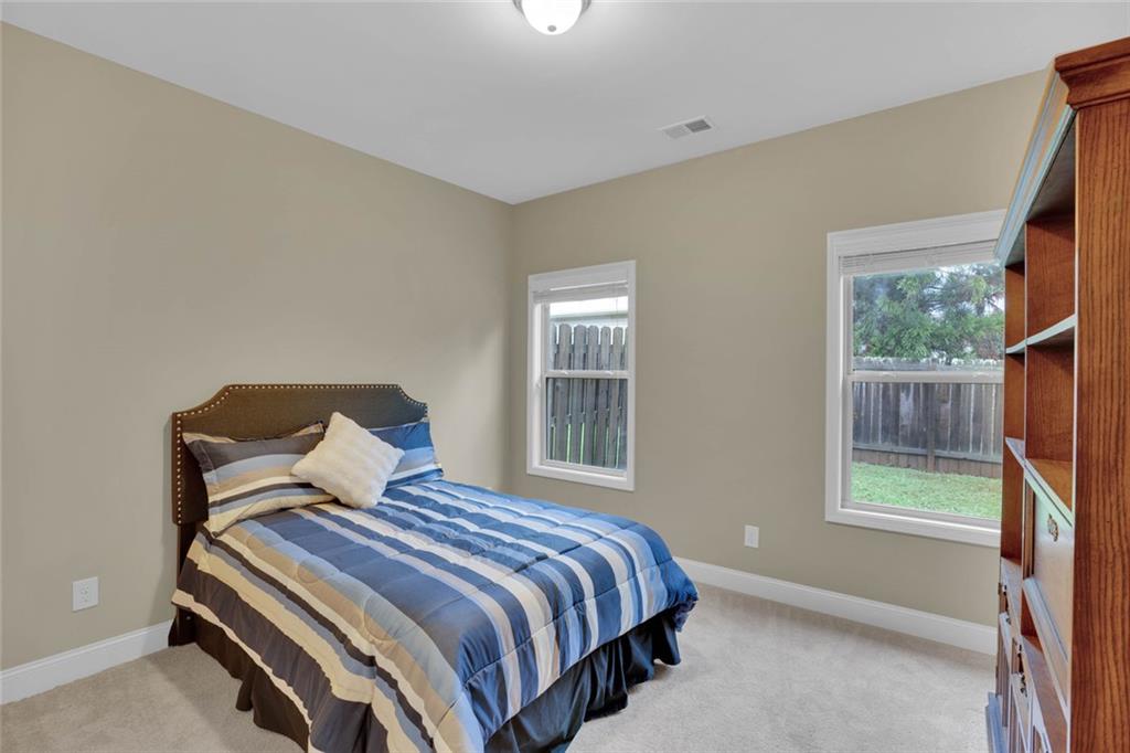 960 Verlander Trail Mableton, GA 30126 - Photo 19 of 30 a bedroom with a bed and window