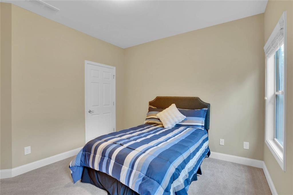 960 Verlander Trail Mableton, GA 30126 - Photo 20 of 30 a bedroom with a bed and a window
