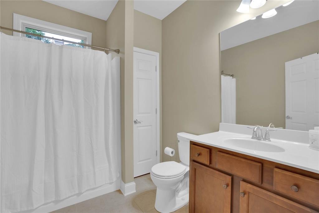 960 Verlander Trail Mableton, GA 30126 - Photo 21 of 30 a bathroom with a sink a toilet and shower