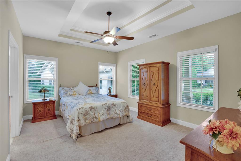 960 Verlander Trail Mableton, GA 30126 - Photo 3 of 30 a bedroom with a bed and a chandelier