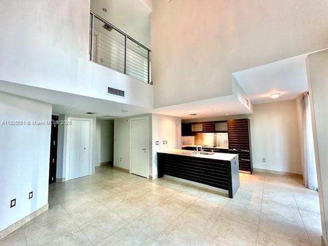 200 Biscayne Blvd Way, Unit 701 Miami, FL 33131 - Photo 5 of 12 a large kitchen with a stove and a refrigerator
