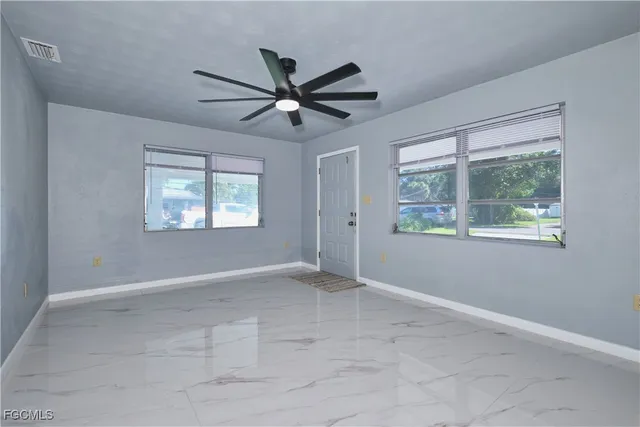 a view of an empty room with a window