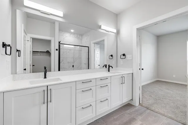 a kitchen with stainless steel appliances a refrigerator sink and stove