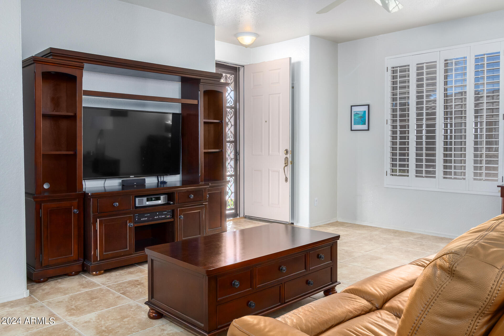 2063 South Edgewater Mesa, AZ 85209 - Photo 6 of 35 a living room with furniture and a flat screen tv