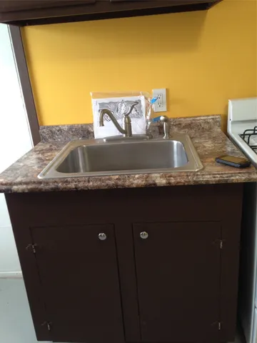 a view of a balcony with chair and table