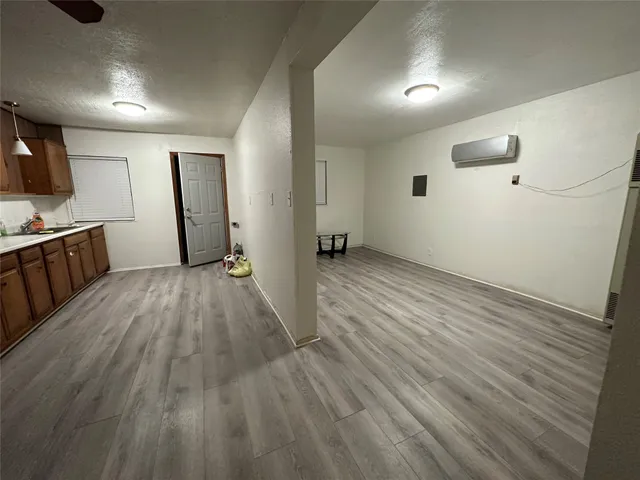 a view of a livingroom with wooden floor