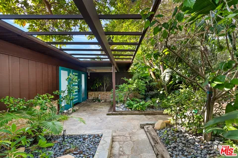 a view of a pathway with a yard
