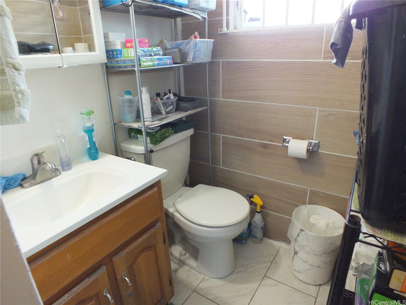 828 Puuhale Road, Unit 209 Honolulu, HI 96819 - Photo 12 of 22 a bathroom with a toilet and a sink