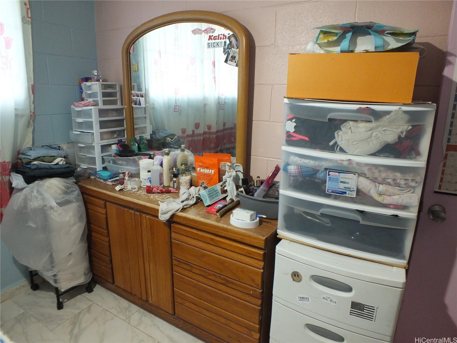 828 Puuhale Road, Unit 209 Honolulu, HI 96819 - Photo 15 of 22 a room with furniture and a mirror