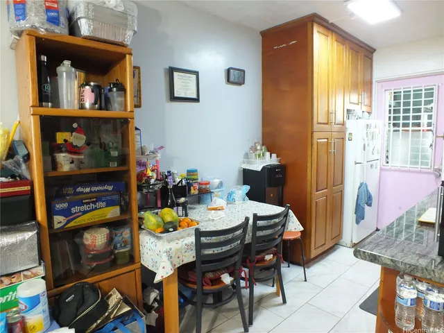a dining room with furniture and a window
