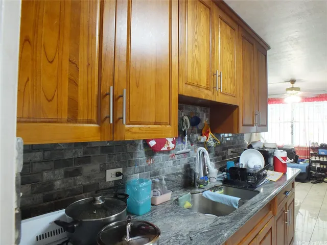 a kitchen with a sink and a cabinets