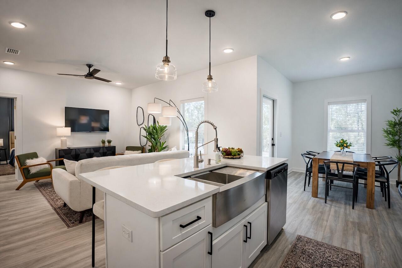 2021 Baldwin Street Chipley, FL 32428 - Photo 12 of 35 a kitchen that has a table and chairs in it