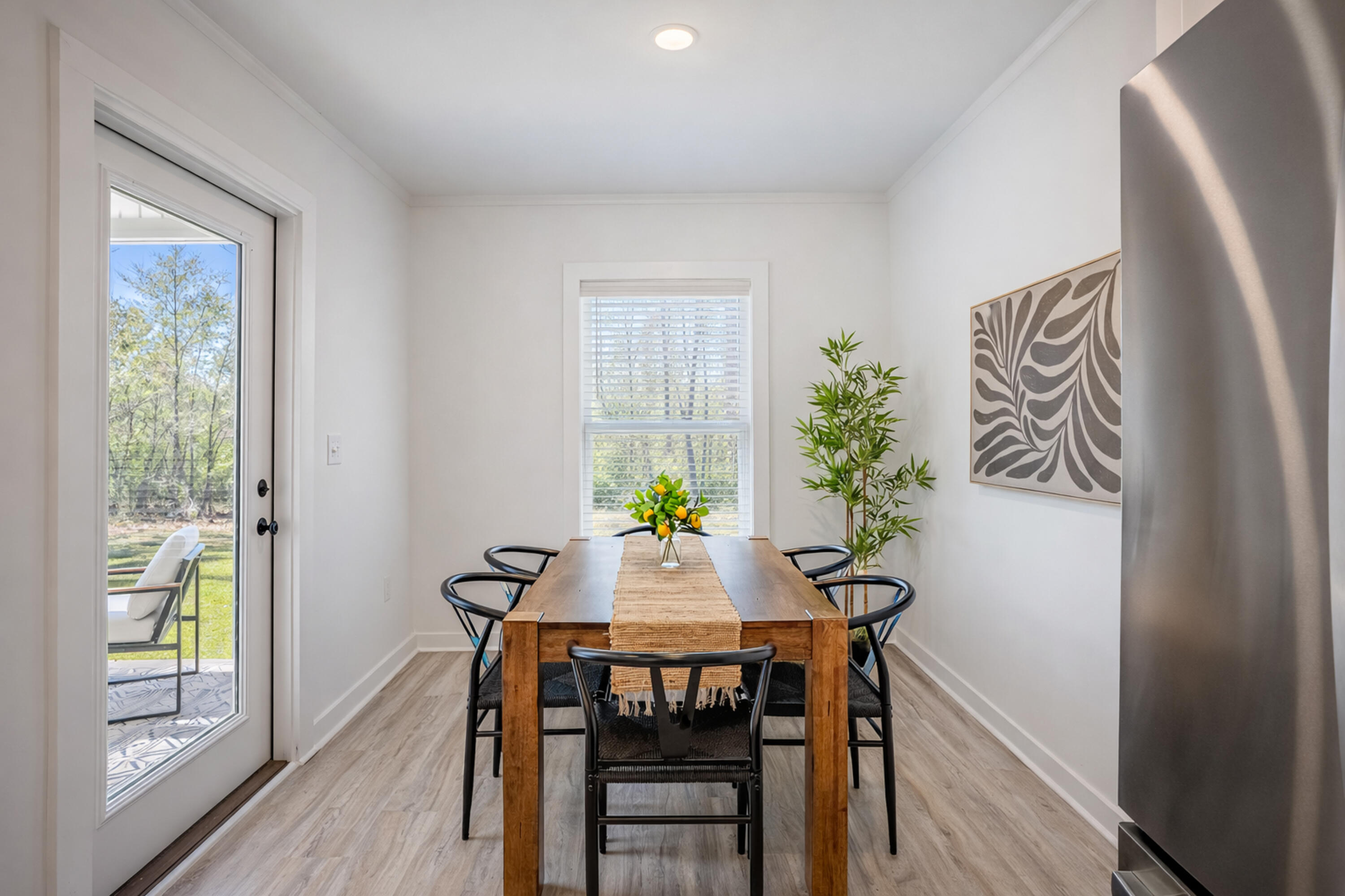 2021 Baldwin Street Chipley, FL 32428 - Photo 13 of 35 a view of a dining room with furniture window and wooden floor