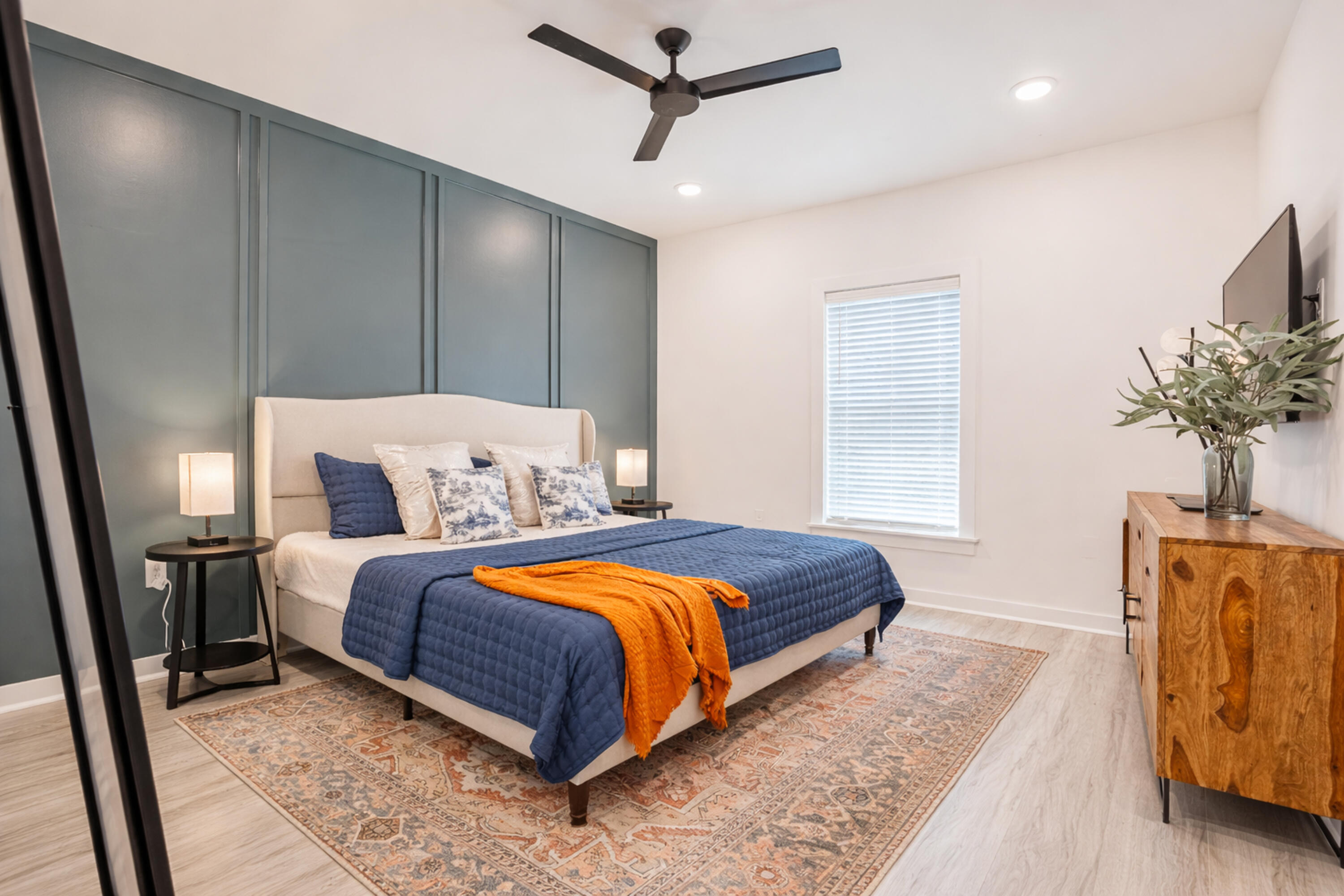 2021 Baldwin Street Chipley, FL 32428 - Photo 18 of 35 a bedroom with a bed and a chandelier