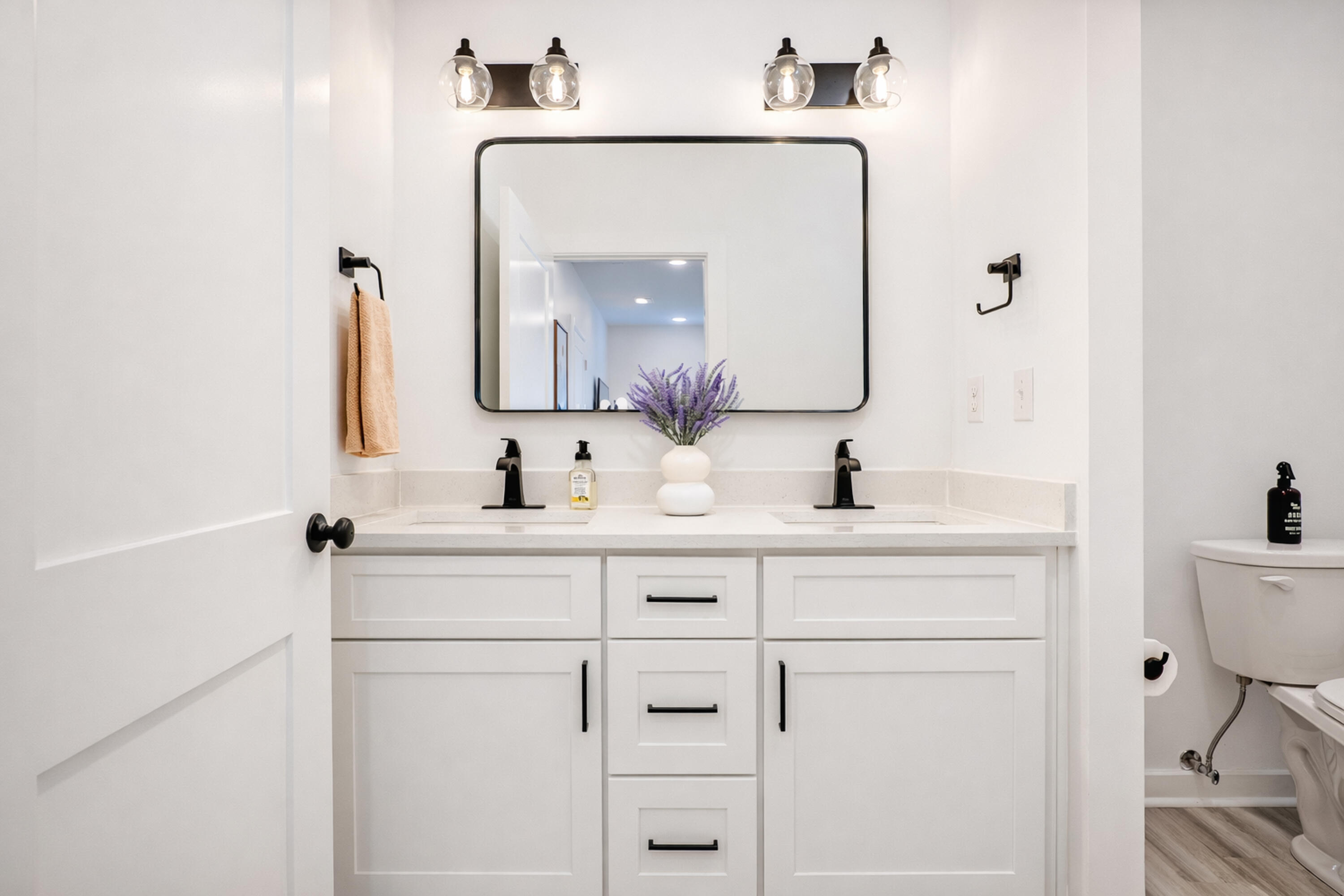 2021 Baldwin Street Chipley, FL 32428 - Photo 20 of 35 a bathroom with a double vanity sink mirror and