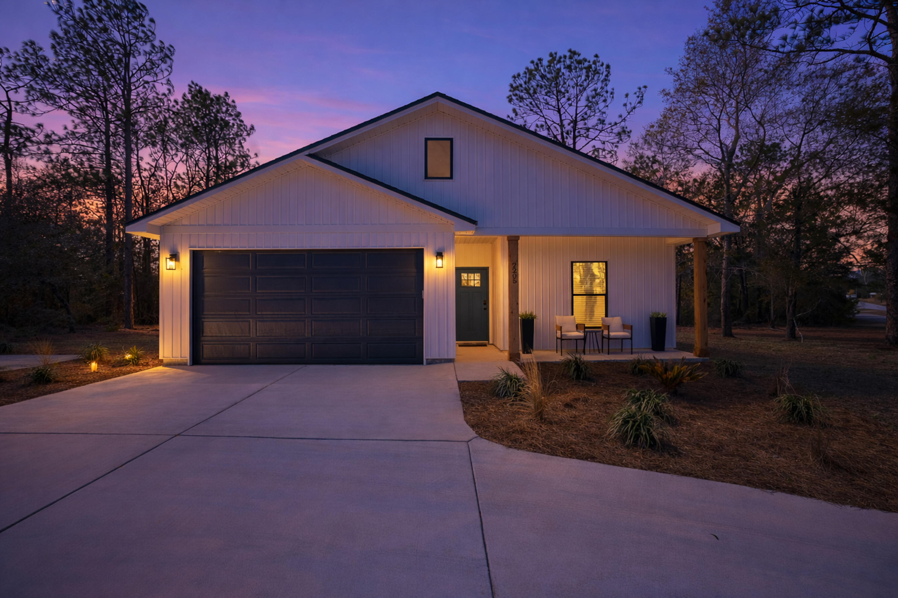 2021 Baldwin Street Chipley, FL 32428 - Photo 2 of 35 a front view of a house with garden