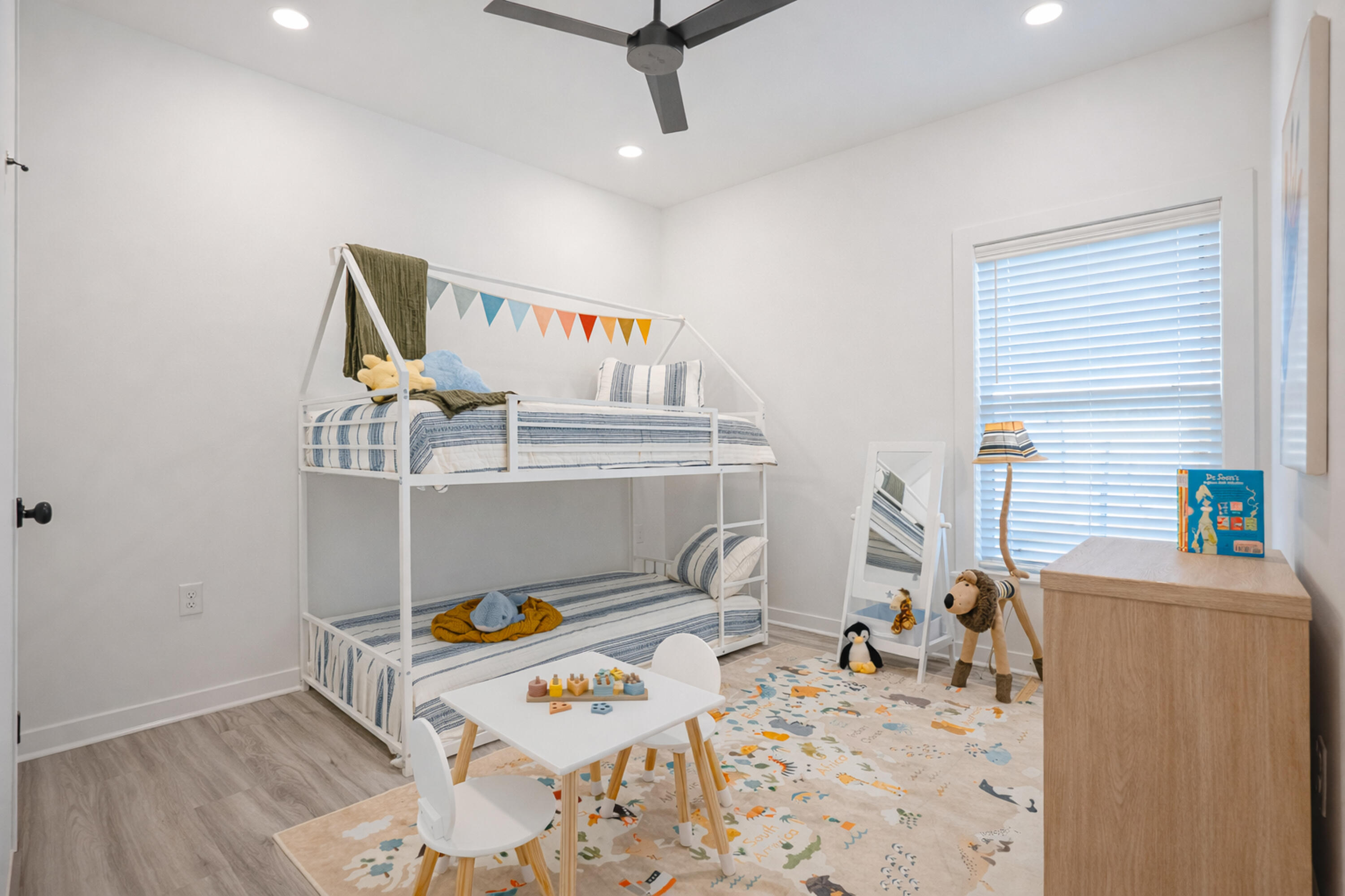 2021 Baldwin Street Chipley, FL 32428 - Photo 25 of 35 a bedroom with furniture and a wooden floor