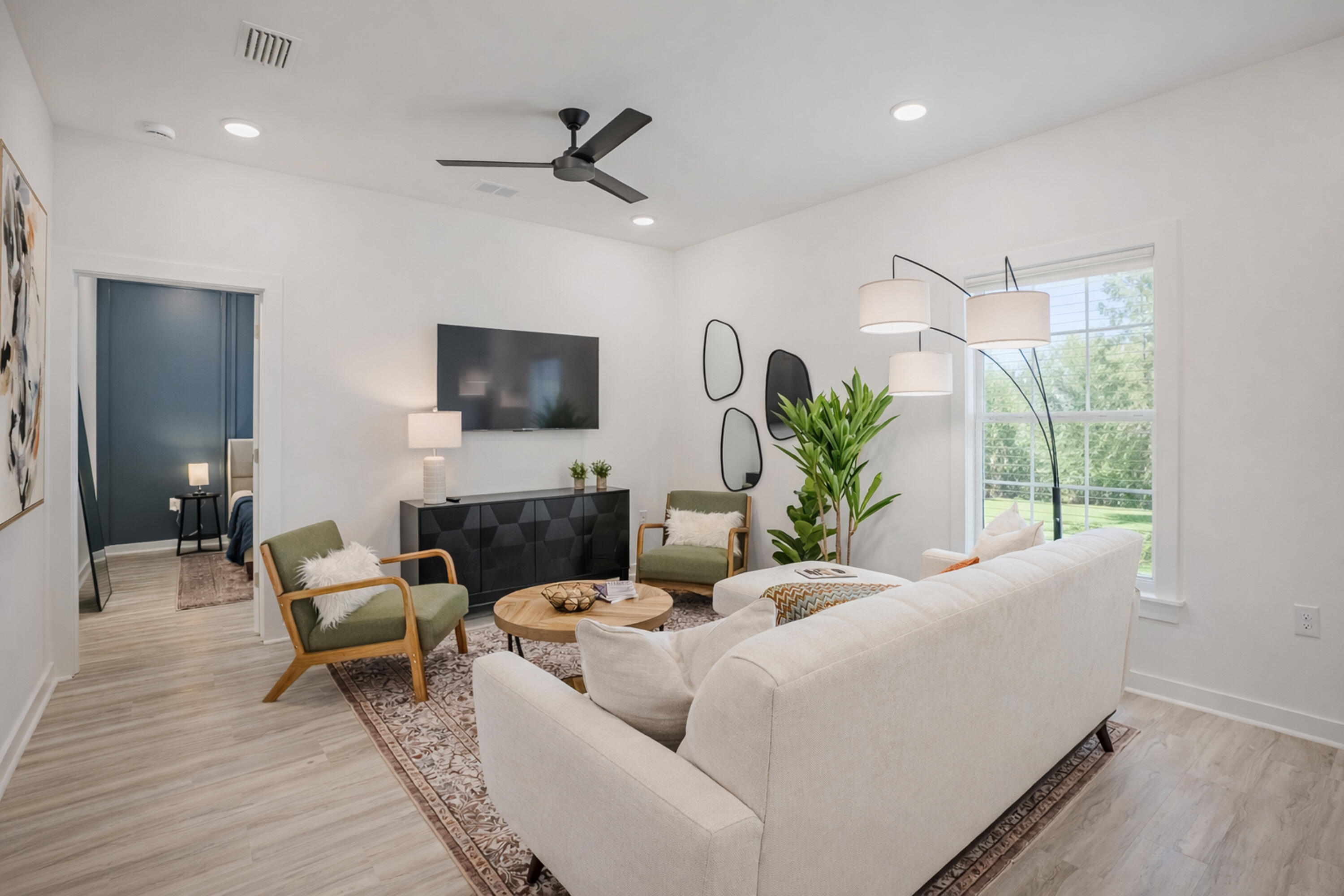 2021 Baldwin Street Chipley, FL 32428 - Photo 6 of 35 a living room with furniture and a flat screen tv