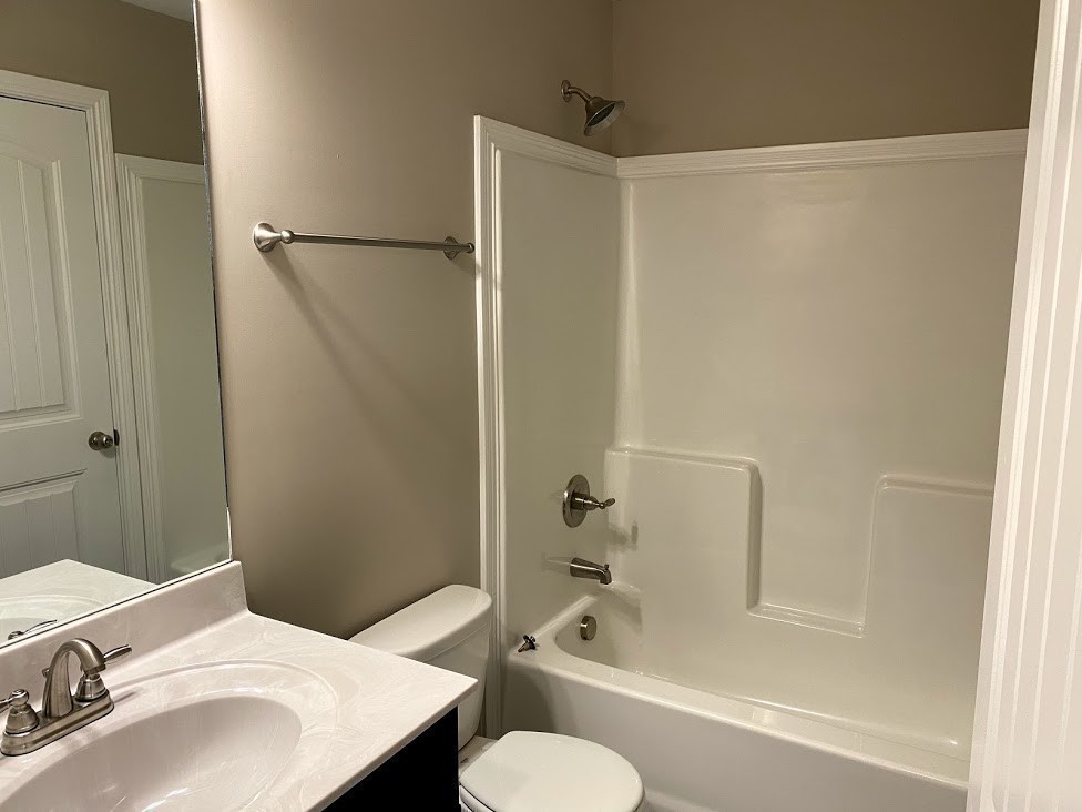 555 Heritage Pointe Drive, Unit B Clarksville, TN 37042 - Photo 9 of 9 a bathroom with a sink and a mirror