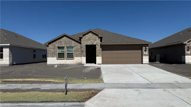 a front view of a house with garage