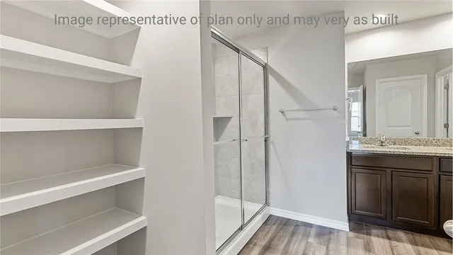 a bathroom with a sink and mirror