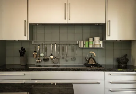 a kitchen with a sink and large window