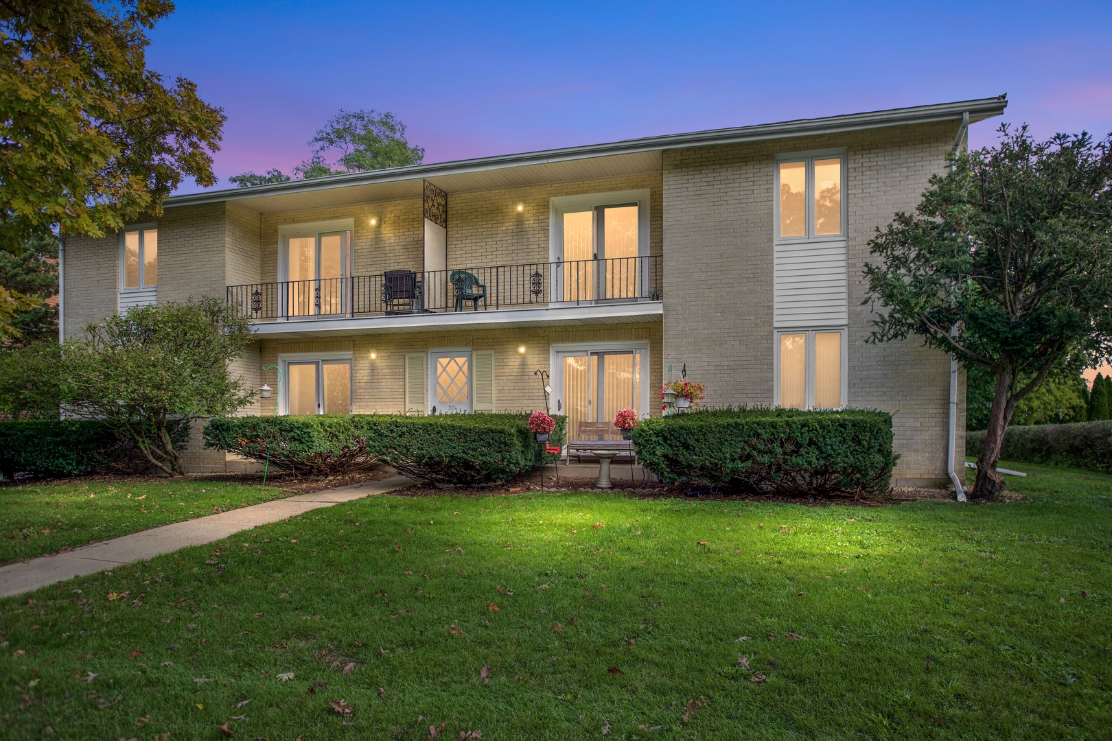 31 Green Oaks Drive, Unit B Crystal Lake, IL 60014 - Photo 1 of 24 a front view of a house with a yard