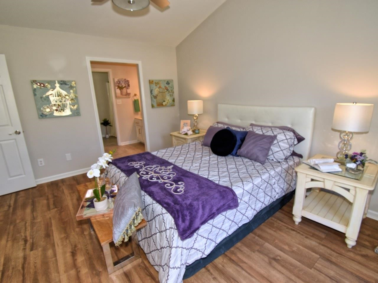 2201 Ruddy Road Raleigh, NC 27616 - Photo 13 of 27 a bedroom with a bed and a lamp on dresser