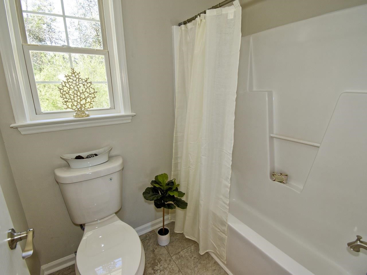 2201 Ruddy Road Raleigh, NC 27616 - Photo 16 of 27 a bathroom with a toilet and a bathtub