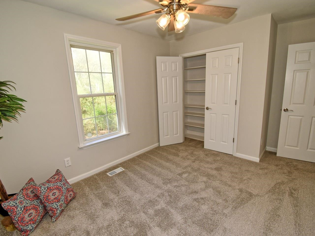 2201 Ruddy Road Raleigh, NC 27616 - Photo 21 of 27 an empty room with windows and closet