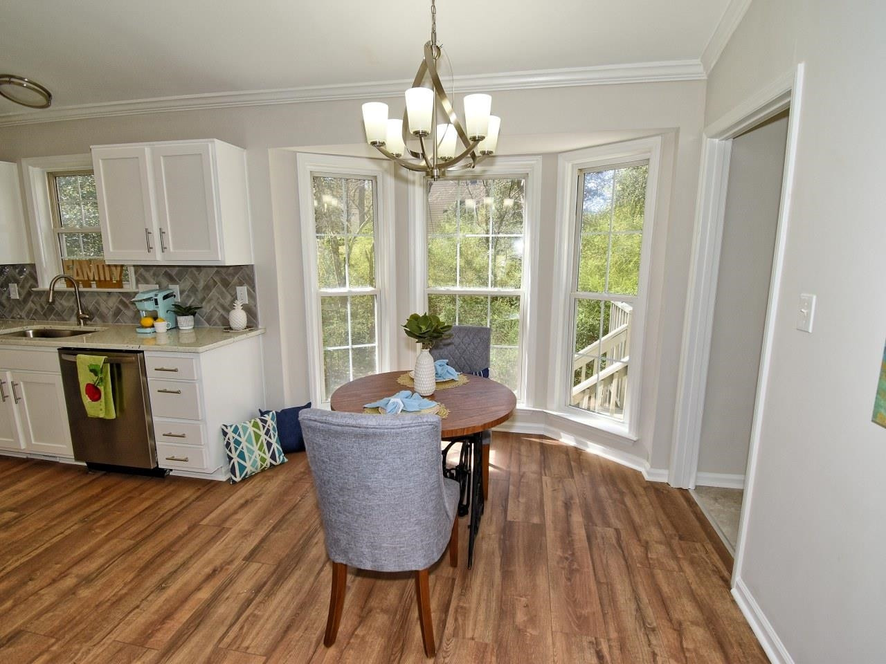 2201 Ruddy Road Raleigh, NC 27616 - Photo 7 of 27 a dining room with furniture a chandelier and wooden floor