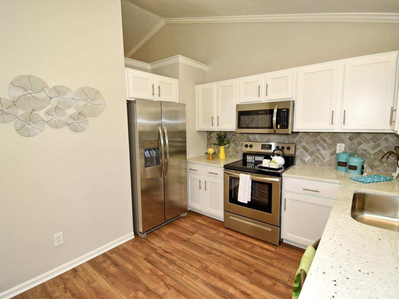 2201 Ruddy Road Raleigh, NC 27616 - Photo 10 of 27 a kitchen with a refrigerator stove and microwave
