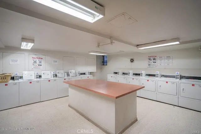 a kitchen with cabinets and white appliances