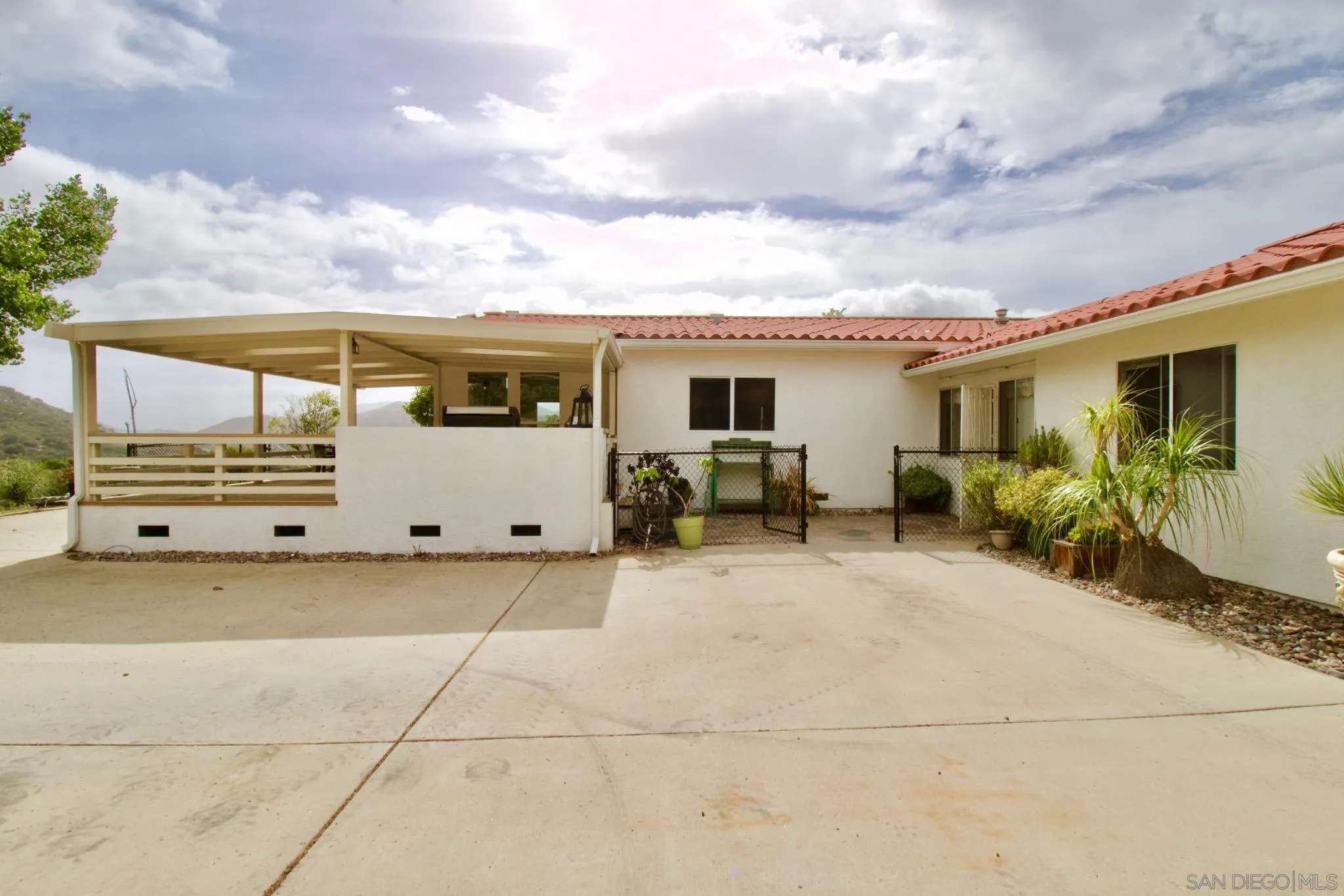 1285 Dehesa Ranch Road El Cajon, CA 92019 - Photo 6 of 61 a view of a house with backyard