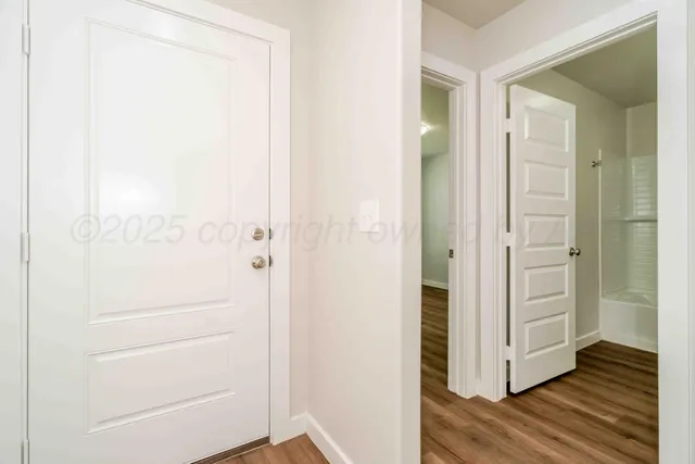 hallway view with wooden floor