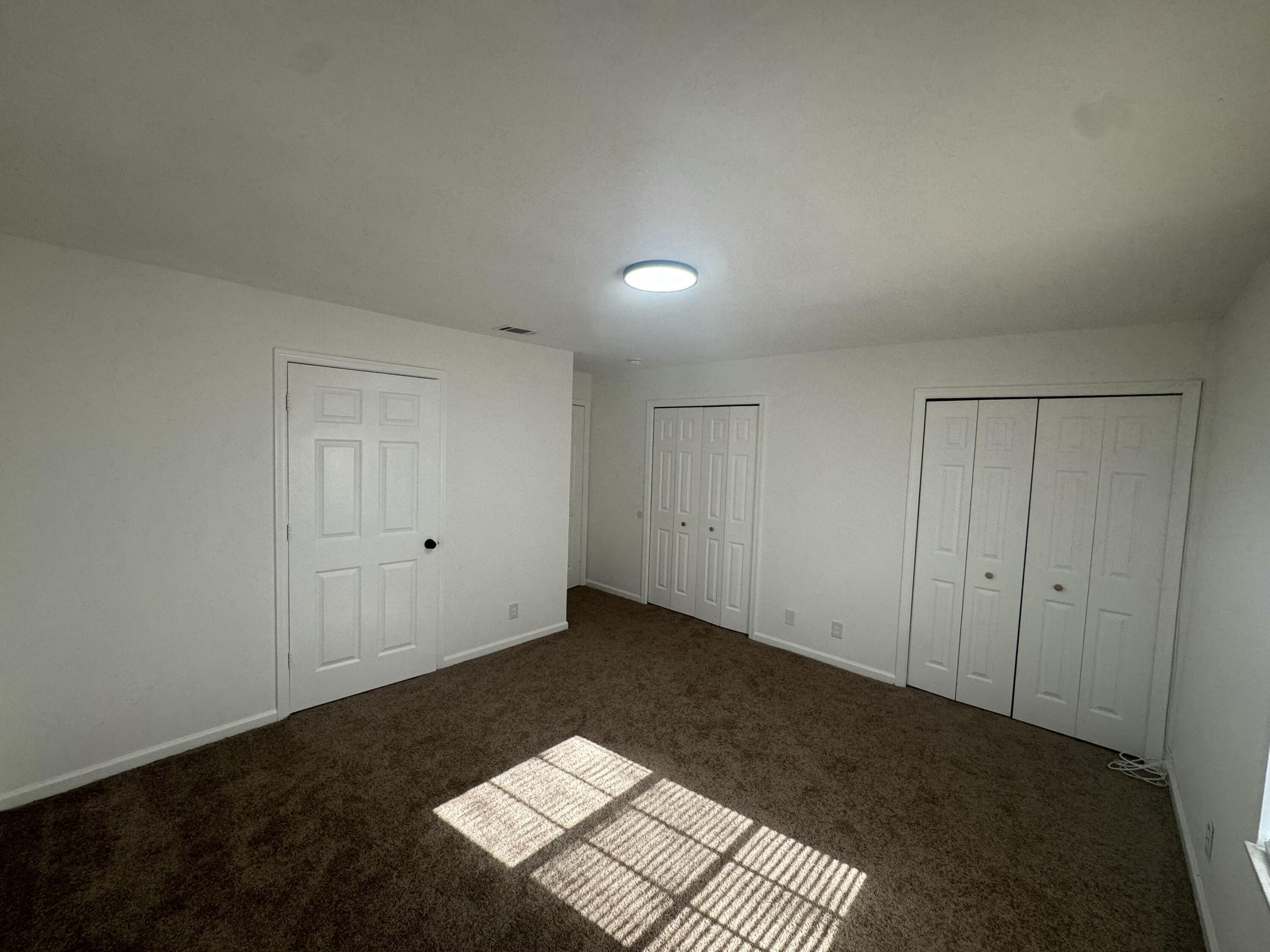 1046 Goldenrod Road, Unit 1048 Wellington, FL 33414 - Photo 9 of 10 a view of an empty room and window