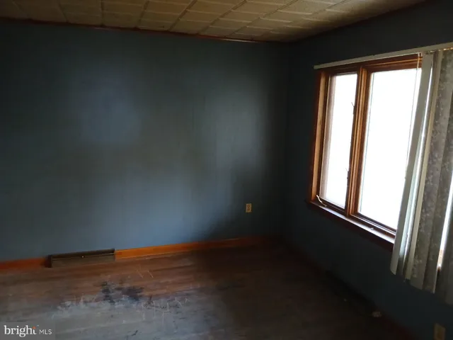 a view of an empty room and window