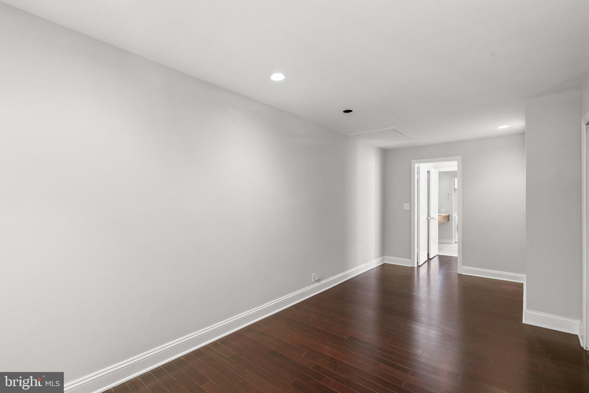 1257 35th Street Northwest Washington, DC 20007 - Photo 16 of 21 a view of an empty room with wooden floor